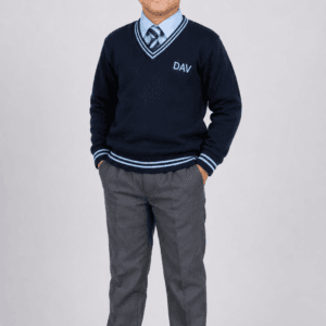 Studio side pose of Indian school boy wearing navy blue DAV full sleeve winter sweater with grey school pants
