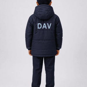 Back side view of Indian school boy wearing navy blue DAV winter jacket with large DAV logo and hood in studio photoshoot